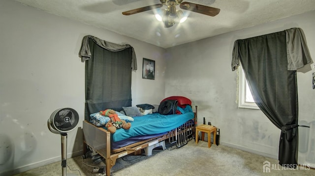 bedroom featuring light colored carpet and ceiling fan