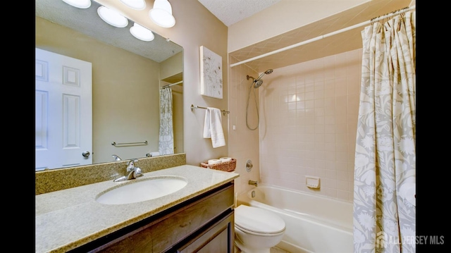 bathroom with shower / bath combo with shower curtain, a textured ceiling, vanity, and toilet