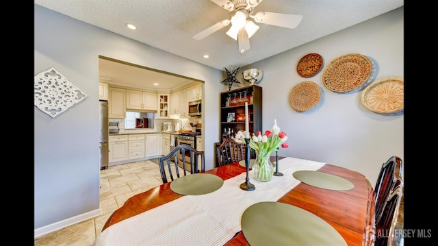 dining room featuring recessed lighting, a textured ceiling, and ceiling fan