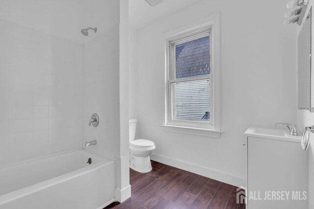 full bathroom with vanity, toilet, and bathing tub / shower combination