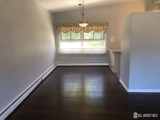 unfurnished dining area featuring a baseboard heating unit, baseboards, and wood finished floors