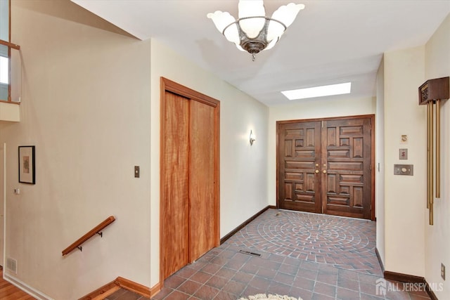 25 Deer Path, Holmdel, NJ 07733 - foyer with a chandelier and tile patterned flooring