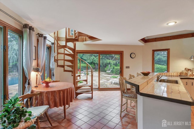 25 Deer Path, Holmdel, NJ 07733 - kitchen with plenty of natural light, tile counters, and light tile patterned flooring