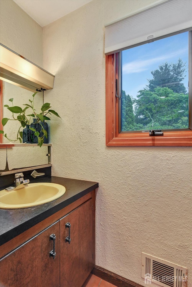 25 Deer Path, Holmdel, NJ 07733 - bathroom featuring vanity, a textured wall, and wood finished floors