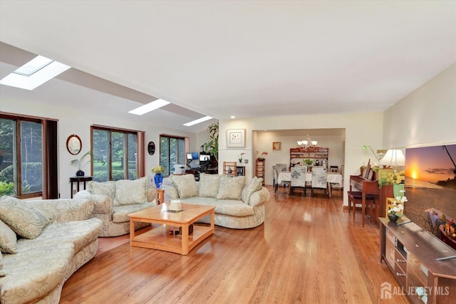 25 Deer Path, Holmdel, NJ 07733 - living area featuring a skylight, a chandelier, and light wood-type flooring