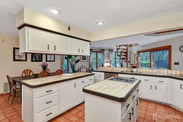25 Deer Path, Holmdel, NJ 07733 - kitchen featuring tile countertops, a peninsula, light tile patterned floors, electric stovetop, and recessed lighting