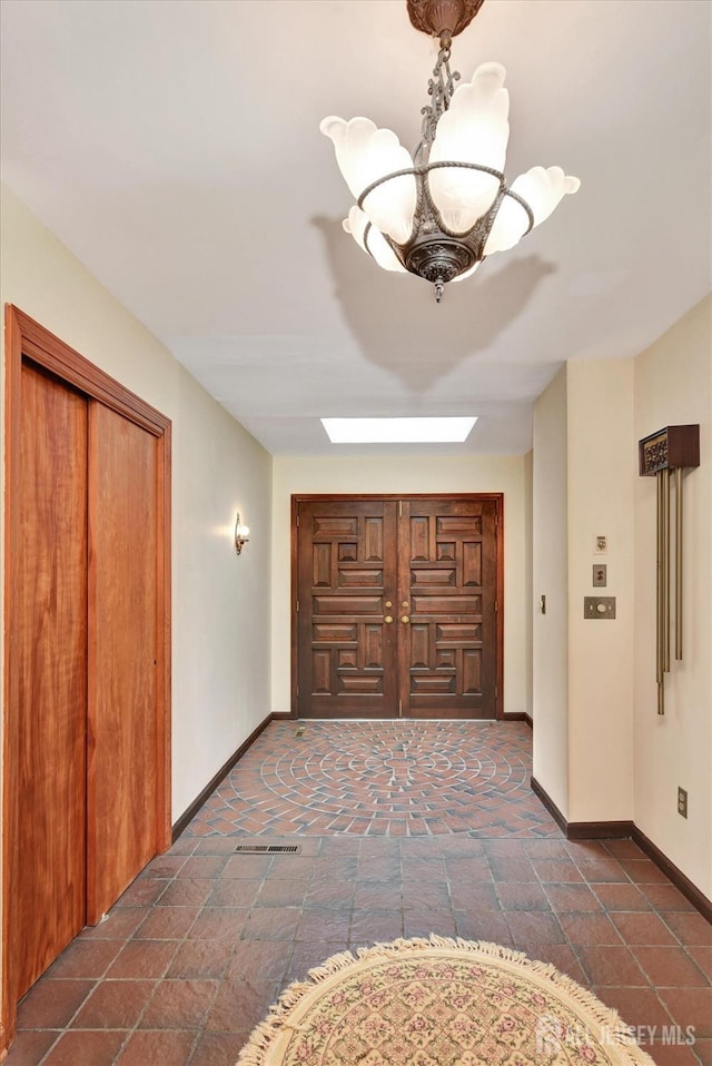 25 Deer Path, Holmdel, NJ 07733 - hallway featuring baseboards and a chandelier