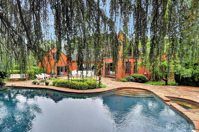 25 Deer Path, Holmdel, NJ 07733 - view of swimming pool featuring a patio and a pool with connected hot tub