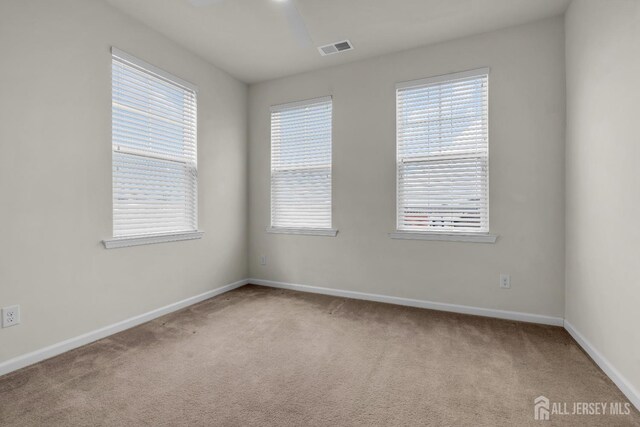 empty room with light colored carpet