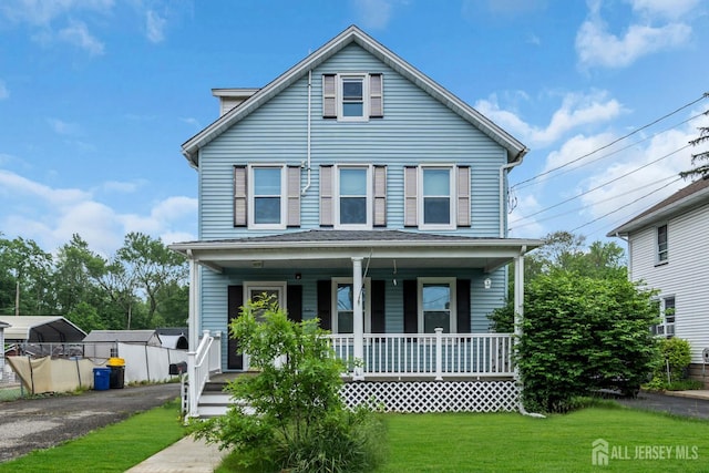12 Dey St, Englishtown, NJ 07726 - view of front of home featuring a porch, a front yard, and asphalt driveway
