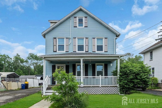 12 Dey St, Englishtown, NJ 07726 - view of front facade with a porch, a front yard, and driveway