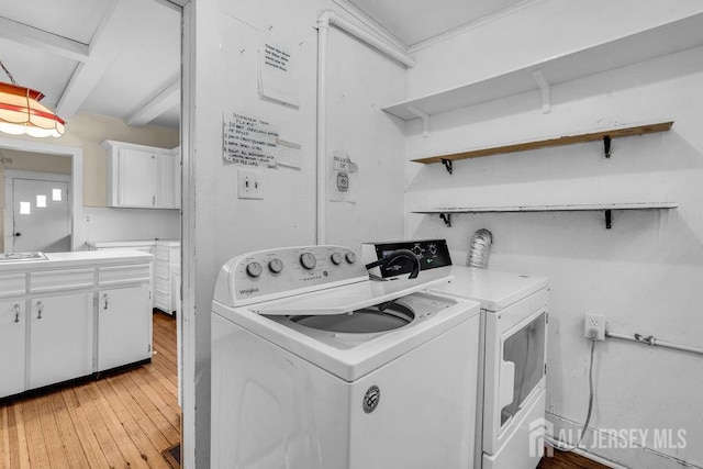 12 Dey St, Englishtown, NJ 07726 - laundry room featuring washer and dryer, light wood-style floors, and cabinet space