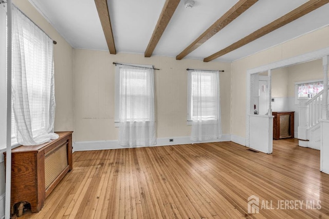 12 Dey St, Englishtown, NJ 07726 - unfurnished room with light wood-type flooring, beamed ceiling, stairs, and a smoke detector