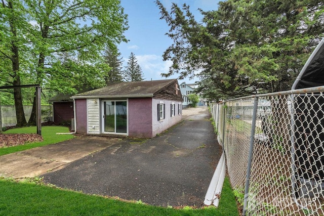 12 Dey St, Englishtown, NJ 07726 - view of property exterior featuring stucco siding and an outbuilding