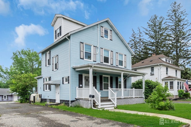 12 Dey St, Englishtown, NJ 07726 - view of front of house with covered porch and a front lawn