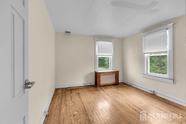 12 Dey St, Englishtown, NJ 07726 - empty room featuring light wood finished floors and radiator heating unit