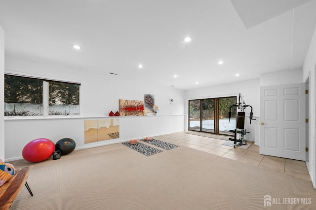 workout area featuring carpet floors, tile patterned flooring, and recessed lighting