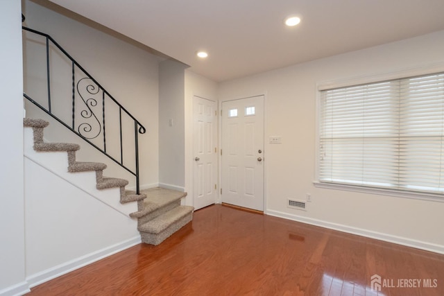 entrance foyer featuring hardwood / wood-style floors