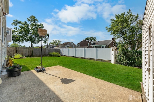 53 Tennyson St, Carteret, NJ 07008 - fenced backyard featuring a patio and a residential view