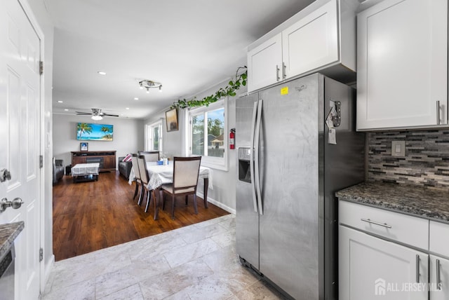 53 Tennyson St, Carteret, NJ 07008 - kitchen with stainless steel fridge, tasteful backsplash, white cabinets, dark stone countertops, and recessed lighting
