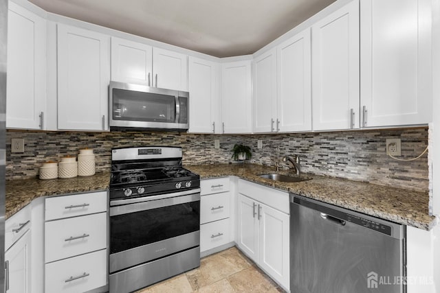 53 Tennyson St, Carteret, NJ 07008 - kitchen featuring stainless steel appliances, dark stone countertops, and decorative backsplash
