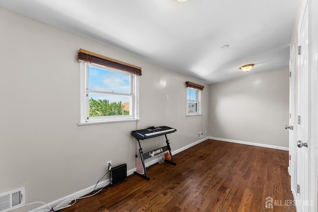53 Tennyson St, Carteret, NJ 07008 - spare room with dark wood-style flooring and baseboards
