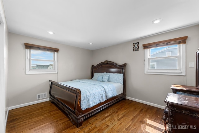 53 Tennyson St, Carteret, NJ 07008 - bedroom with wood finished floors, multiple windows, and recessed lighting