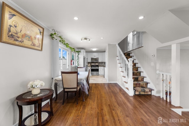 53 Tennyson St, Carteret, NJ 07008 - dining room with stairs, dark wood-style flooring, and recessed lighting