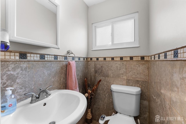 53 Tennyson St, Carteret, NJ 07008 - bathroom featuring tile walls and wainscoting