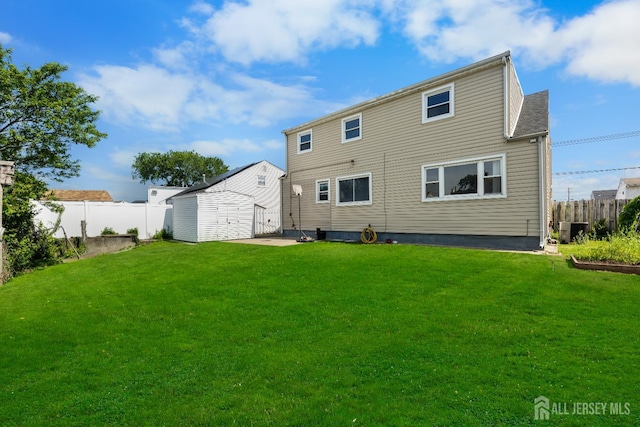 53 Tennyson St, Carteret, NJ 07008 - back of property featuring a fenced backyard and an outbuilding