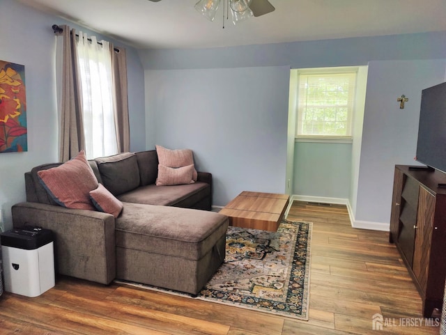 10-P Sussex Way, Monroe, NJ 08831 - living room with ceiling fan, plenty of natural light, wood finished floors, and baseboards