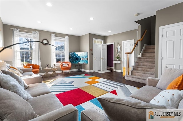 living room with wood finished floors, recessed lighting, baseboards, and stairs