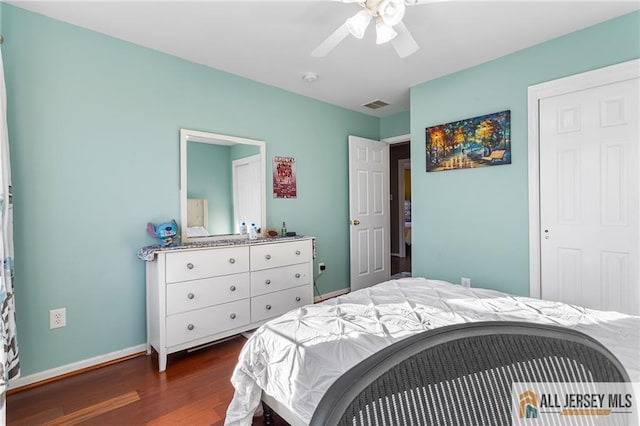 bedroom featuring ceiling fan, baseboards, dark wood finished floors, and visible vents