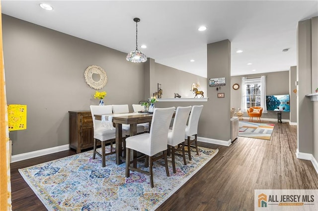dining space with baseboards, recessed lighting, and wood finished floors