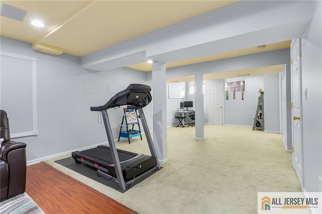 workout room featuring baseboards and recessed lighting