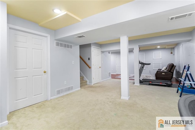 workout area featuring visible vents and carpet floors