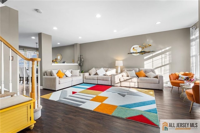 living room with recessed lighting and wood finished floors