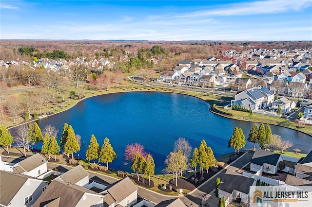 birds eye view of property featuring a residential view and a water view