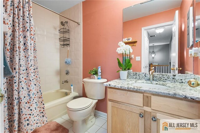 bathroom featuring toilet, shower / bathtub combination with curtain, vanity, and tile patterned flooring