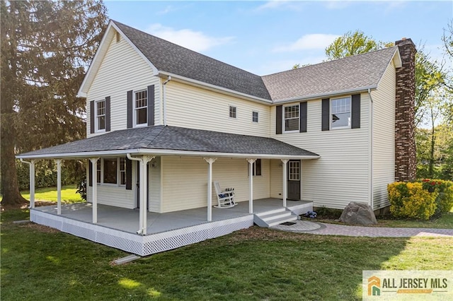 226 Gravel Hill Rd, Monroe, NJ 08831 - view of front of property featuring a chimney, covered porch, and a front lawn