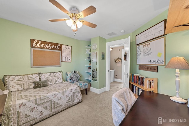 interior space featuring visible vents, ceiling fan, and baseboards