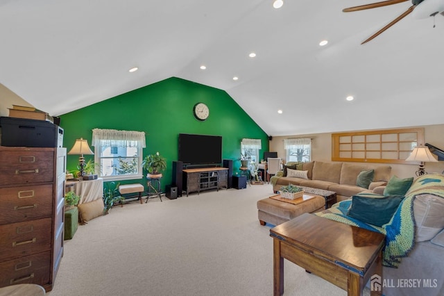 carpeted living area with ceiling fan, recessed lighting, and high vaulted ceiling