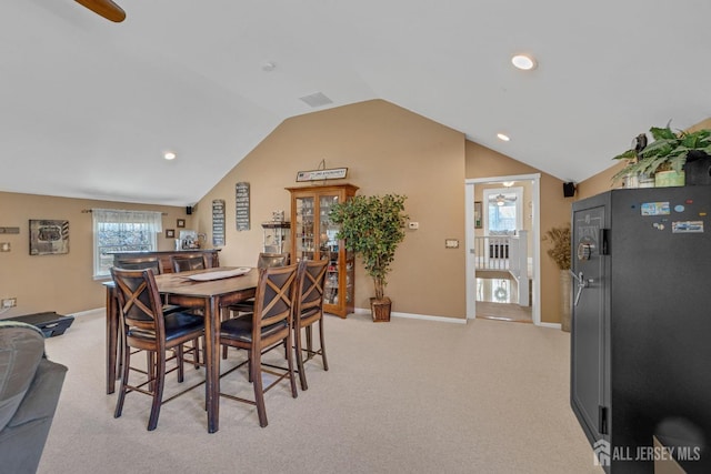 dining area with recessed lighting, baseboards, vaulted ceiling, and light carpet