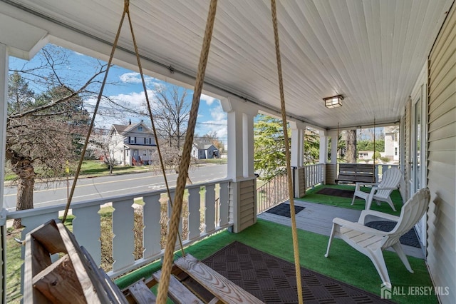 sunroom featuring a residential view