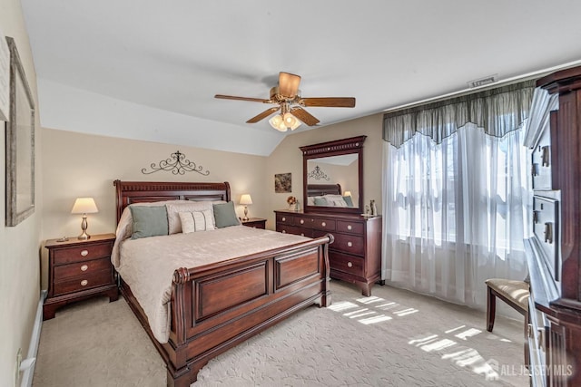 bedroom with baseboards, visible vents, light carpet, and ceiling fan