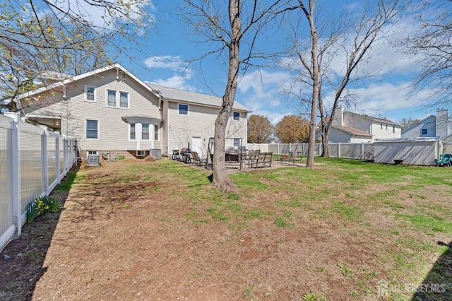 view of yard with a patio and a fenced backyard