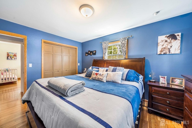 bedroom with a closet and wood finished floors