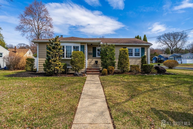 view of front facade with a front yard
