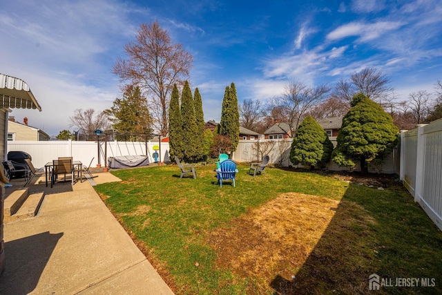 view of yard with a patio and a fenced backyard