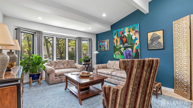 living area with lofted ceiling with beams, recessed lighting, and plenty of natural light